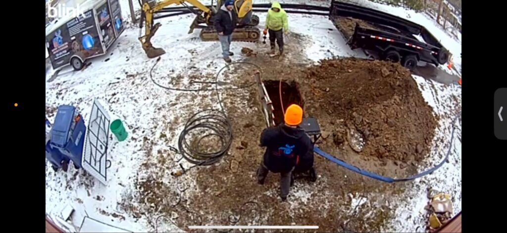 Patriot Trenchless Plumbing crew completing a sewer lining access point excavation at a Montgomery IL job site